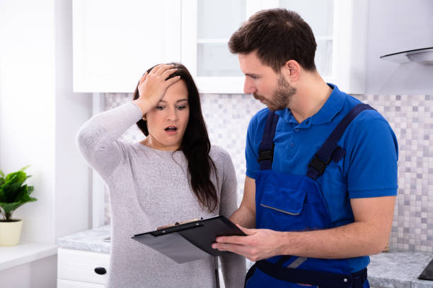istock Handyman Giving Overpriced Invoice For The Service 1128872904