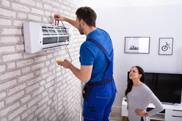 istock Technician Repairing Air Conditioner With Digital Multimeter 1128872926