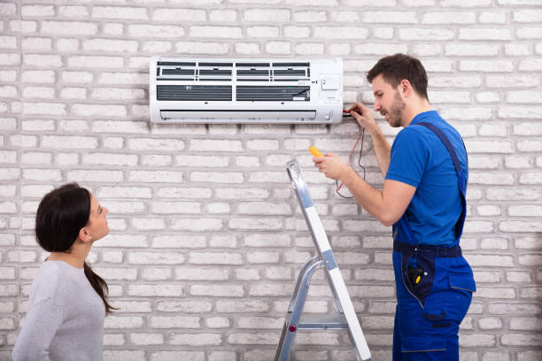 istock Technician Repairing Air Conditioner With Digital Multimeter 1128872930