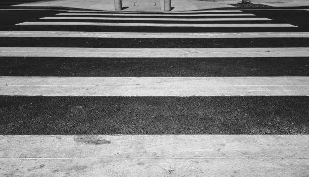 istock Intersection Zebra Crossing, closeup, blacn and white style 1128874772