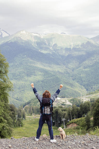 istock ambitious, active hiker is happy as he has reached the hirest mountain 1128875268