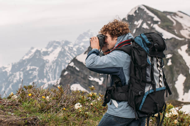istock pleasant young tourist is using the digital camera 1128875375
