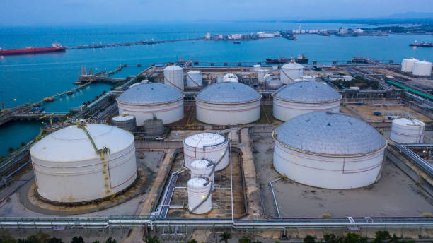 Oil and petrochemical tank, storage of oil and petrochemical products ready for logistic and transport business. Aerial view. Oil and petrochemical tank, storage of oil and petrochemical products ready for logistic and transport business. Aerial view. liquefied natural gas stock pictures, royalty-free photos & images