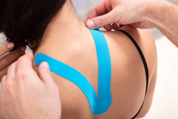 istock Special Physio Tape On Woman's Back 1128875564