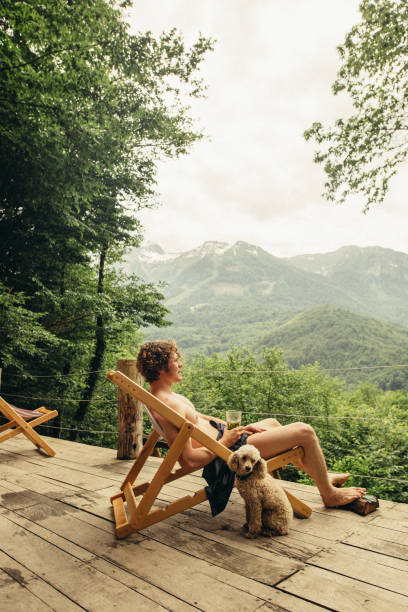 istock handsome tourist sitting on a launge 1128877048
