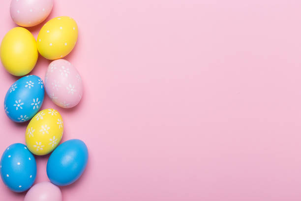 istock Colorfull easter eggs in nest on pastel color background with space. Concept 1128877136