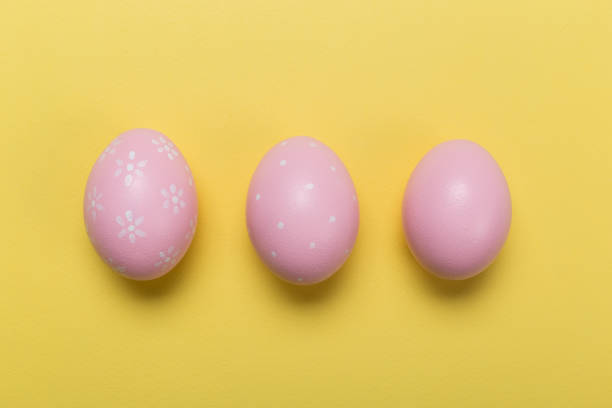 istock easter eggs on yellow pastel color background with space. Concept 1128877148