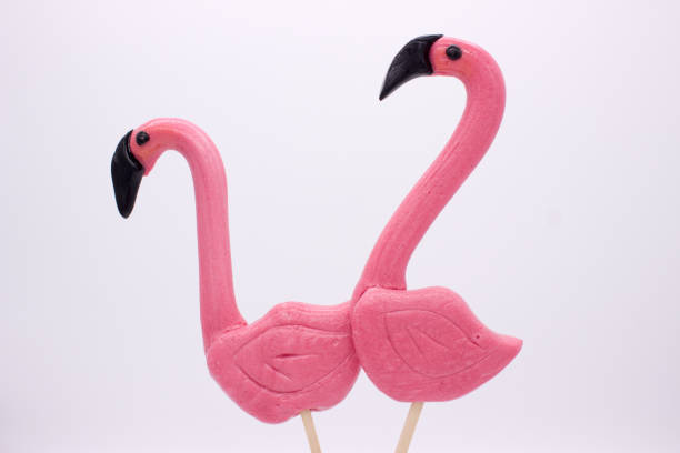 istock Lollipops in the form beautiful flamingo 1128878558