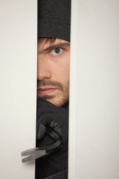 istock Burglar with crowbar 112887874