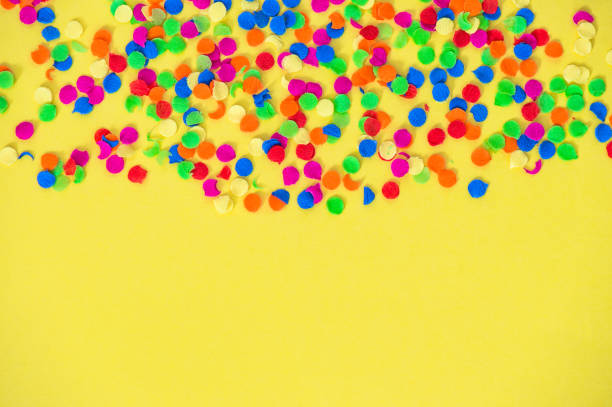 istock Confetti carnival decoration red green blue yellow background 1128879391