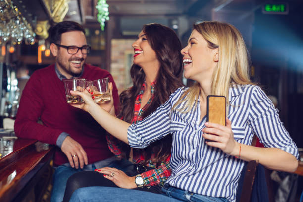 istock Group of people in the bar 1128879554