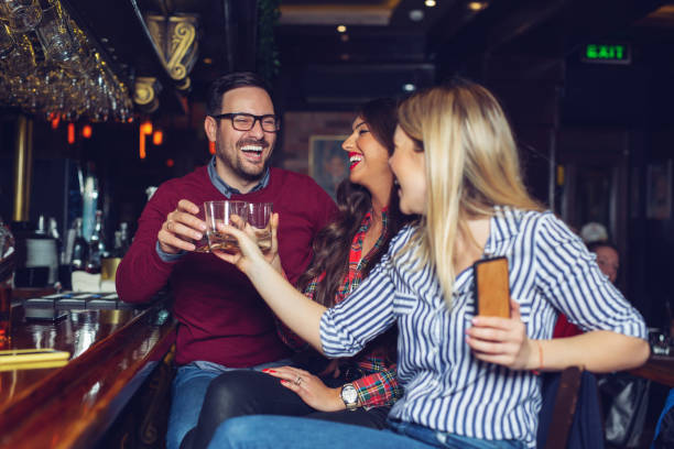 istock Group of people in the bar 1128879727