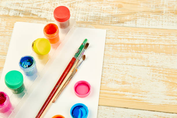 istock Watercolor palettes and paint brushes. Artist workplace 1128880198