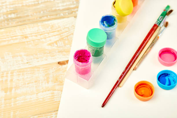 istock Watercolor palettes and paint brushes. Artist workplace 1128880205