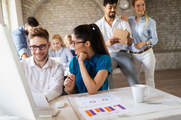 istock Business, technology and people concept - creative team or designers working in office 1128880633