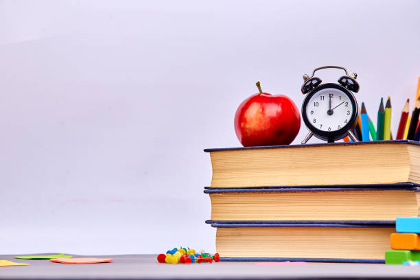 istock Back to school supplies. Books and red apple 1128881631