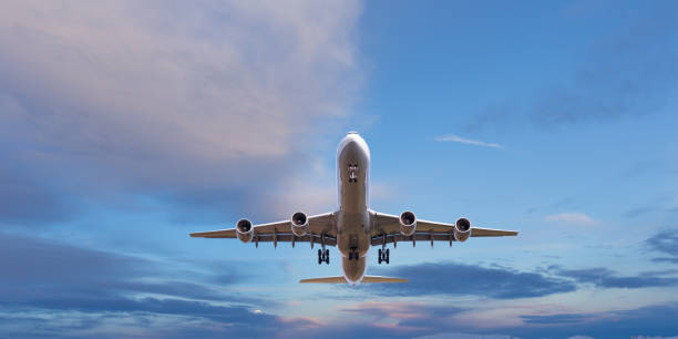 istock Commercial airplane jetliner flying above dramatic clouds. 1128881966