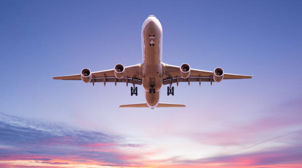 istock Commercial airplane jetliner flying above dramatic clouds. 1128881969