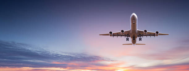 istock Commercial airplane jetliner flying above dramatic clouds. 1128881982