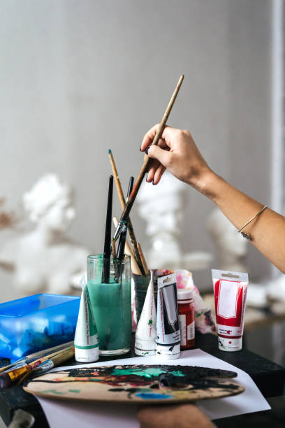 istock Artist painting in her studio 1128882054