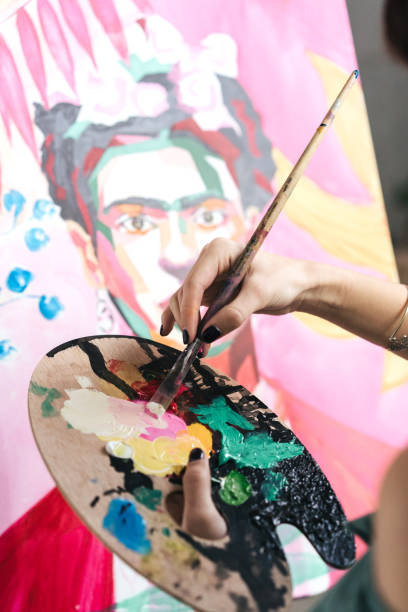 istock Artist painting in her studio 1128882231