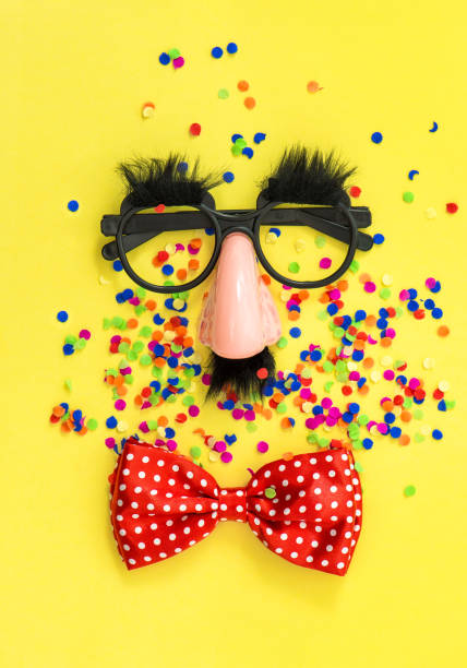 istock Carnival mask clown Holidays background flat lay 1128882352