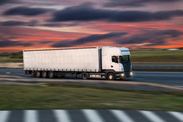 istock Truck with container on road, cargo transportation concept. 1128883124