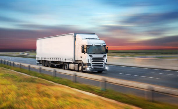 istock Truck with container on road, cargo transportation concept. 1128883131