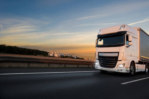 istock Truck with container on road, cargo transportation concept. 1128883147