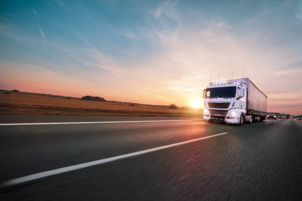 istock Truck with container on road, cargo transportation concept. 1128883175