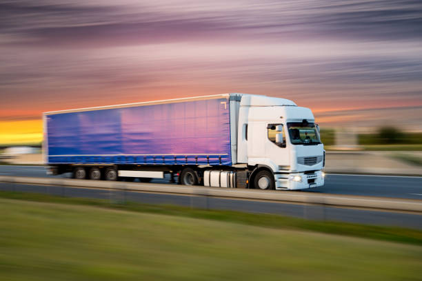 istock Truck with container on road, cargo transportation concept. 1128883187