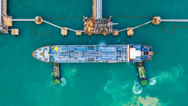 istock Fuel tanker ship loading in port view from above, Tanker ship logistic import export business and transportation, Aerial view. 1128883747