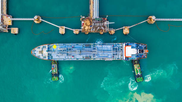 fuel tanker ship loading in port view from above, tanker ship logistic import export business and transportation, aerial view. - oil shipping industrial ship oil tanker imagens e fotografias de stock