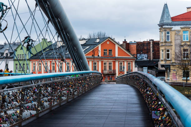 Krakow, Poland - January 2, 2019: Bernatek Footbridge in Krakow old town characteristic by its unique design on a cloudy winter day