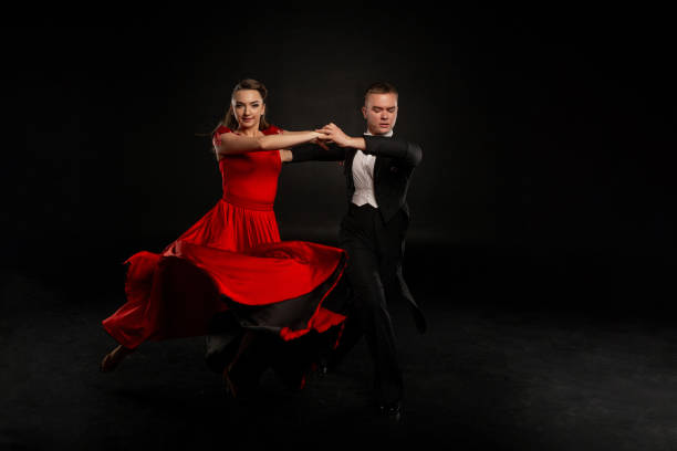 istock Beautiful couple in the active ballroom dance 1128884907