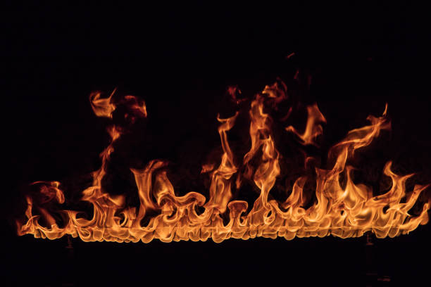 istock Texture of fire on a black background. 1128884947