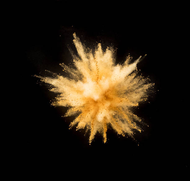 istock Golden powder explosion on black background. 1128885285