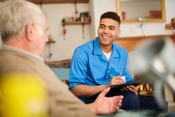 istock care nurse checking patient at home 1128885542