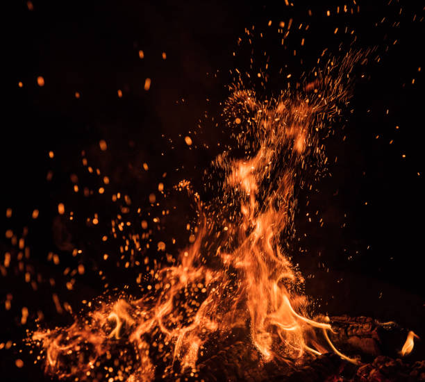 istock Burning sparks flying. Beautiful flames background. 1128885707