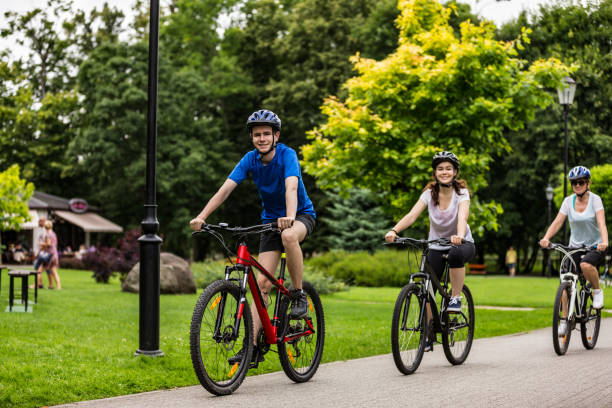 istock Urban biking- three people riding bikes in city 1128886148
