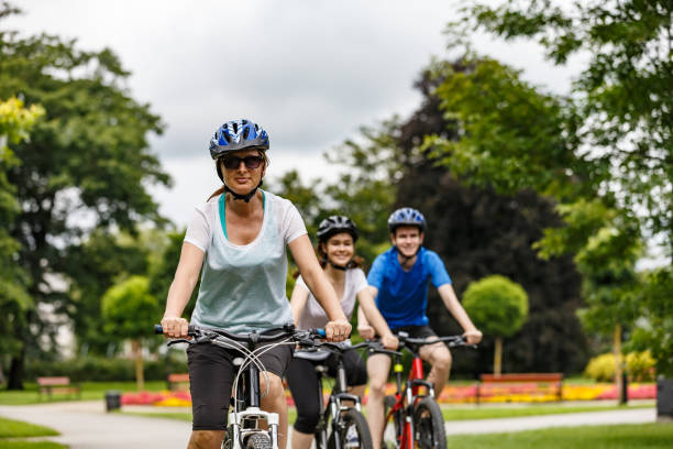 istock Urban biking- three people riding bikes in city 1128886213