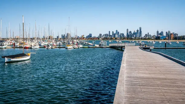 St Kilda marina full of boats view from the pier and Melbourne Skyline in background in Saint Kilda Melbourne Victoria Australia