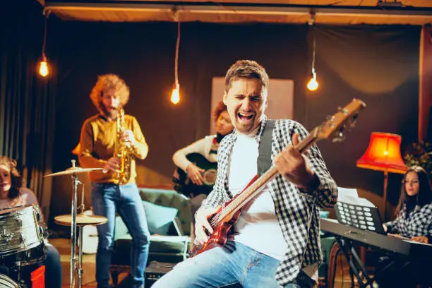 Photo of Multicultural jazz band practicing for the gig.