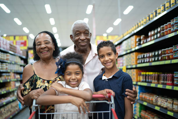 Afro latinx grandparents and grandchild at grocery store portrait Family on Supermarket afro latinx ethnicity stock pictures, royalty-free photos & images