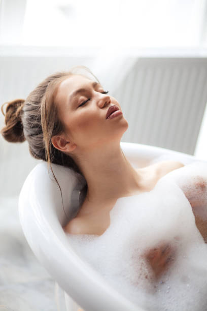 istock good-looking model with brown hair having relax in the spa salon 1128890422