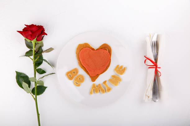 istock Heart shaped pancakes on white plate.  Be mine. Festive breakfast on white table. Love concept. Happy Valentine