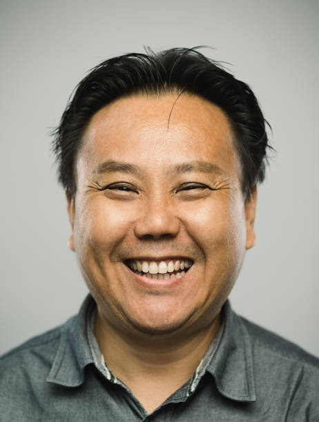 istock Real chinese mature man with excited expression looking at camera 1128891935