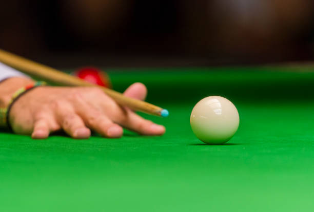 istock playing snooker - man aiming the cue ball 1128892504