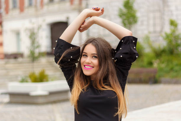 istock Stylish girl in city 1128893821