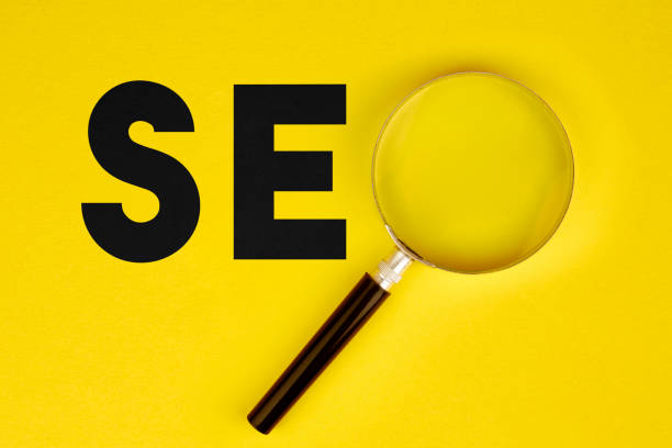 istock Focus Concept - Magnifier And Seo Text On Yellow Background 1128896069